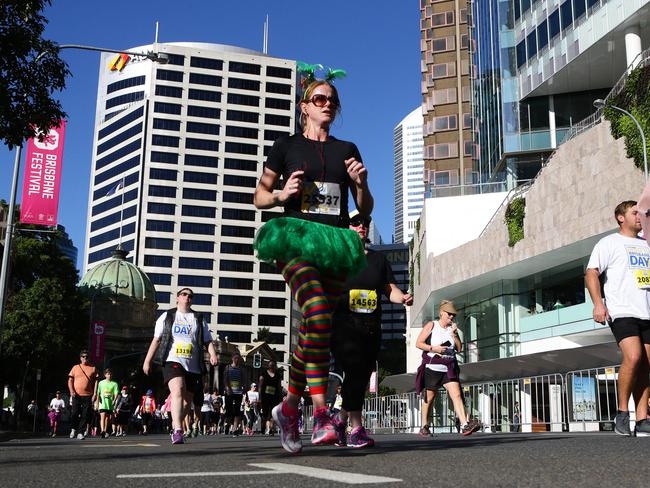 <p>Eli Baak of New Farm running on Queen Street during the Bridge to Brisbane.</p>