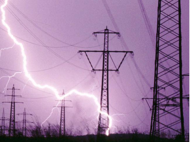 The early evening sky over Kirchheim southeast of Munich appears in violet colours as a mighty lightning bolt strikes one of the high power electricity transmission line masts during a thunderstorm Jul 01, 1997. (AP Photo/Uwe/Lein) weather o/seas storms germany pylon pylons