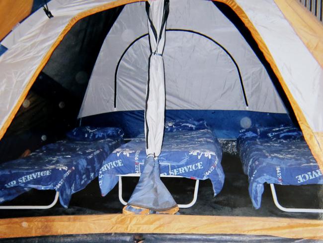 Eleven of the children living in tents (above) and filthy sheds on the Colt incest family farm were found to have interrelated parents. Picture: News Corp.
