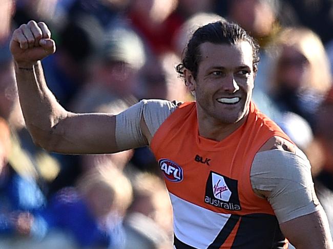 Sam Reid of the Giants celebrates after kicking a goal during the round 19 AFL match between the Greater Western Sydney (GWS) Giants and the Richmond Tigers at Manuka Oval, in Canberra, Saturday, July 30, 2016. (AAP Image/Dan Himbrechts) NO ARCHIVING, EDITORIAL USE ONLY