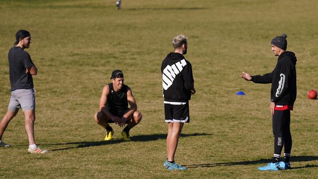 Scott Pendlebury and Jeremy Howe of the Magpies with Michael Hibberd and Jake Melksham of the Demons at Elsternwick Park. Picture: AAP