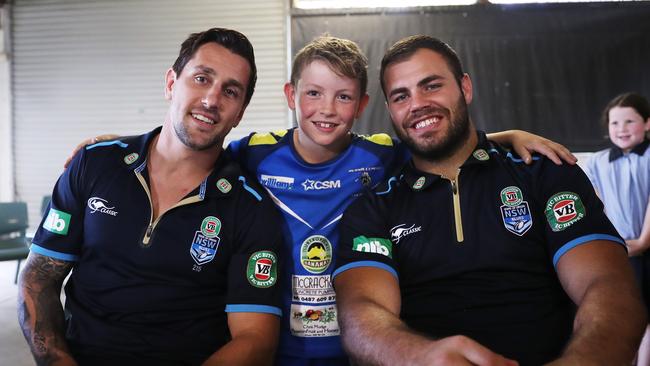 Mitchell Pearce and Wade Graham with Luca Stuart during the visit at Murwillumbah Leagues Club.