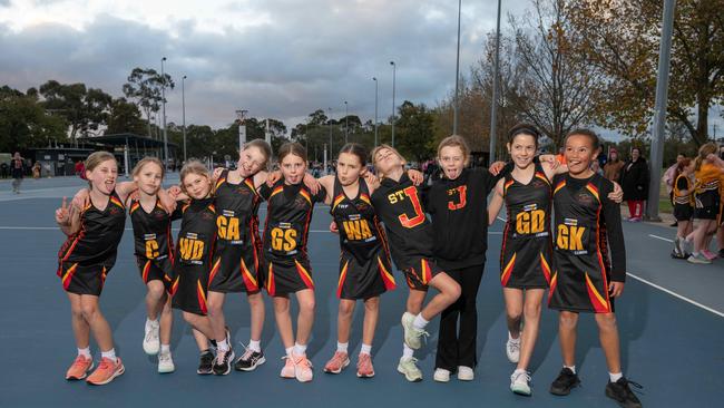 St Joesph’s Yellow under-11 netball team pull their funniest faces.