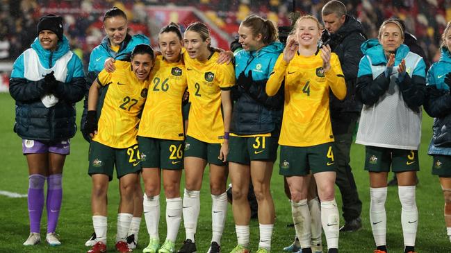 BRENTFORD, ENGLAND - APRIL 11: Players of Australia celebrate after defeating England during the Women's International Friendly match between England and Australia at Gtech Community Stadium on April 11, 2023 in Brentford, England. (Photo by Ryan Pierse/Getty Images)