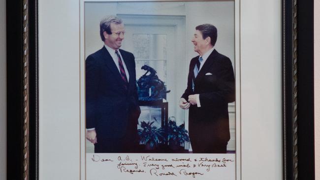 A signed photograph of Culvahouse with Ronald Reagan, tagged for the move to Canberra.