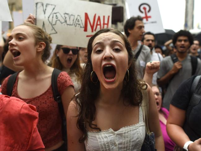 Women hold a  protest in front of Trump Tower in New York on October 4, 2018 against Supreme Court nominee Brett Kavanaugh. - Top Republicans voiced confidence Thursday that Brett Kavanaugh will be confirmed to the US Supreme Court this weekend, as they asserted that an FBI probe had found nothing to support sex assault allegations against Donald Trump's nominee."Judge Kavanaugh should be confirmed on Saturday," Senator Chuck Grassley of Iowa, the chairman of the Senate Judiciary Committee, told reporters. (Photo by TIMOTHY A. CLARY / AFP)