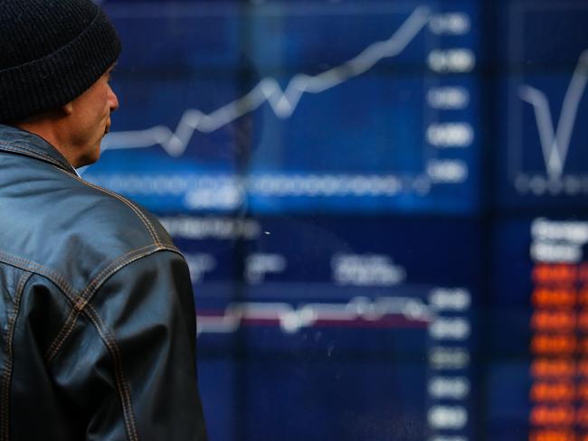 SYDNEY, AUSTRALIA - NewsWire Photos JULY 05, 2021: A member of the public is seen checking the stocks at the ASX in the CBD, as we enter week 2 of Covid-19  lockdown in Sydney Australia. Picture: NCA NewsWire / Gaye Gerard