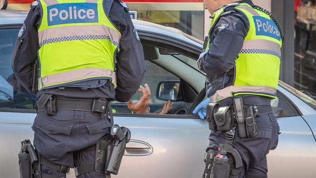 Police speak with a driver during Thursday’s operation in Richmond. Picture: Jason Edwards