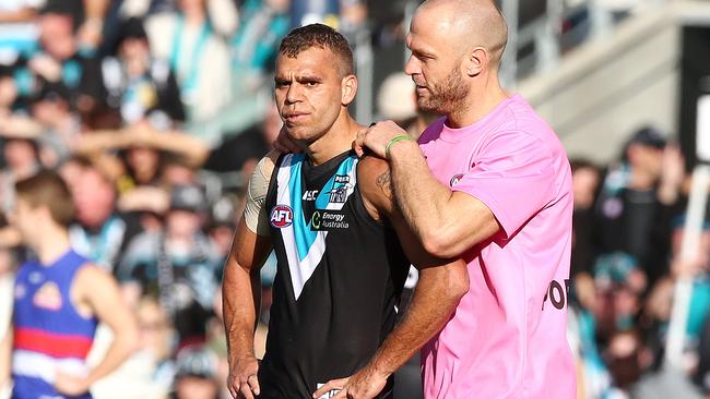 Port Adelaide runner Chad Cornes talks to Nathan Krakouer. Picture: Sarah Reed