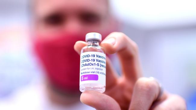 BRISBANE, AUSTRALIA - NewsWire Photos - AUGUST 8, 2021. Pharmacist Michael Thorp holds a vial of the AstraZeneca Covid-19 vaccine the at the Carina Day and Night pharmacy in Brisbane. Picture: NCA NewsWire / Dan Peled