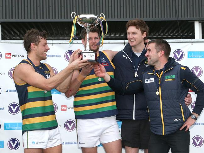 (L - R) Captains Nick Wood and Anthony Lynch and coaches Tom Williams and Guy Martyn of St Kevins. Picture: Hamish Blair