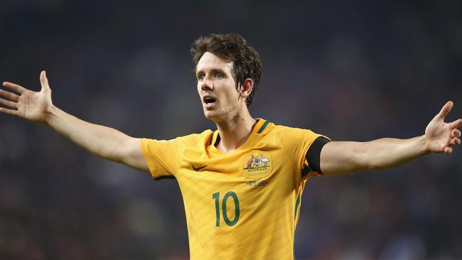 Robbie Kruse of the Socceroos appeals to the linesman.
