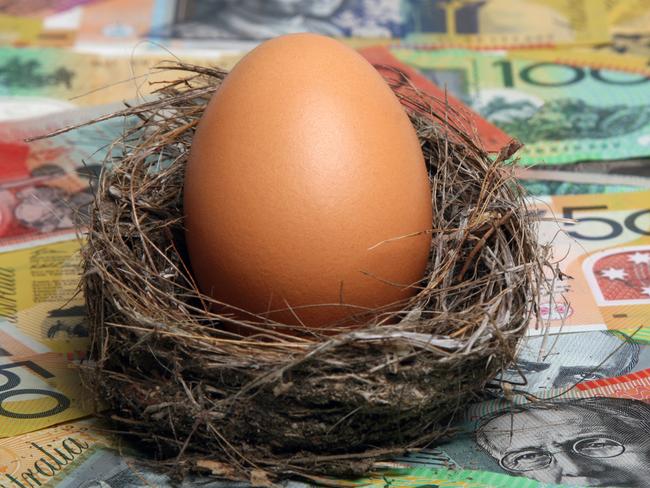 Savings nest egg with Australian dollar notes aa focus on egg. Click to see more...