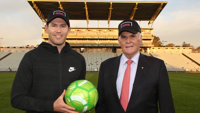 Billionaire Lang Walker poses Campbelltown bid ambassador Brett Emerton. Picture: AAP