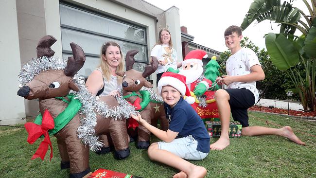 For Bulletin's Christmas lights competition. Bianca Edwards with kids Braxtyn 9, Ellirah 11 and Kynan 14 getting their display underway. Picture: Richard Gosling