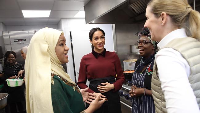 Smyth (right) and Meghan Markle visit the Hubb Community Kitchen in London. Picture: Getty