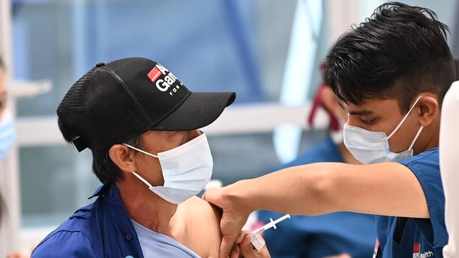 NSW residents get the Covid-19 vaccine inside the Vaccination Hub at Sydney Olympic Park. Picture: NCA NewsWire / Jeremy Piper