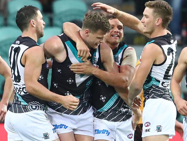 LAUNCESTON, AUSTRALIA - MAY 25: Peter Ladhams of the Power is congratulated by his teammates after kicking a goal during the round 10 AFL match between the Hawthorn Hawks and the Port Adelaide Power at University of Tasmania Stadium on May 25, 2019 in Launceston, Australia. (Photo by Scott Barbour/Getty Images)