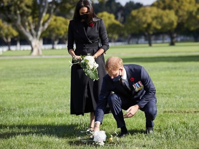 Prince Harry and Meghan Markle lay a wreath at Los Angeles National Cemetery. Picture: Getty