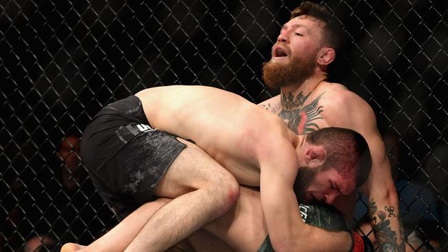 Khabib Nurmagomedov of Russia holds down Conor McGregor of Ireland in their UFC lightweight championship bout during the UFC 229 event at T-Mobile Arena in Las Vegas. Picture: Getty Images