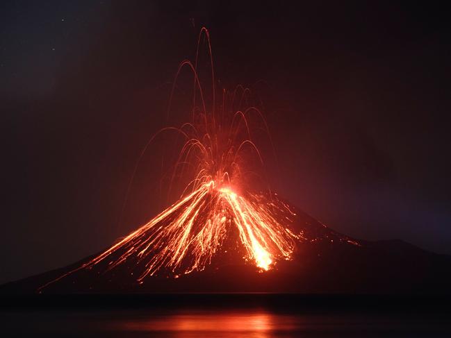 Lava streams down from Anak Krakatau (Child of Krakatoa) volcano during an eruption as seen from Rakata island in South Lampung on July 19, 2018. An Indonesian volcano known as the 