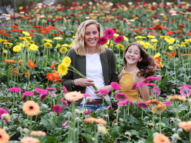 Florist Sonia Bitmead with her daughter Molly, 12, at their flower farm at Karalee. Pics Tara Croser.