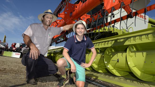 In the action: Russell Heard  and son Lachlan, from Wonwondah, look at a Claas 760 Lexion, Lake Bolac Claas Centre at last year’s event.