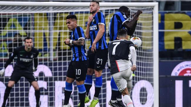 Juventus' Portuguese forward Cristiano Ronaldo shoots a free kick during the Italian Serie A football match against Inter at the San Siro stadium in Milan. Picture: Alberto PIZZOLI / AFP