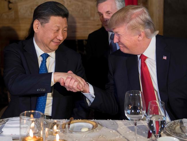 US President Donald Trump and Chinese President Xi Jinping shake hands during dinner at the Mar-a-Lago estate in Florida. Picture: AFP