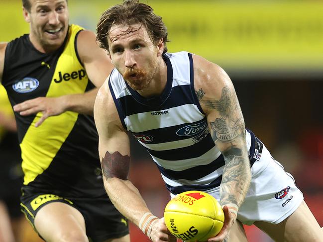 The Cats and Tigers will have to fight against the elements when they play the AFL decider in Brisbane on Saturday night. Picture: Chris Hyde/Getty Images