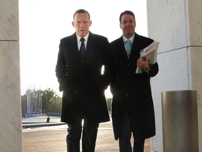 The work begins ... Prime Minister Tony Abbott out the front of Parliament House, the morning after the Budget. Picture: Gary Ramage