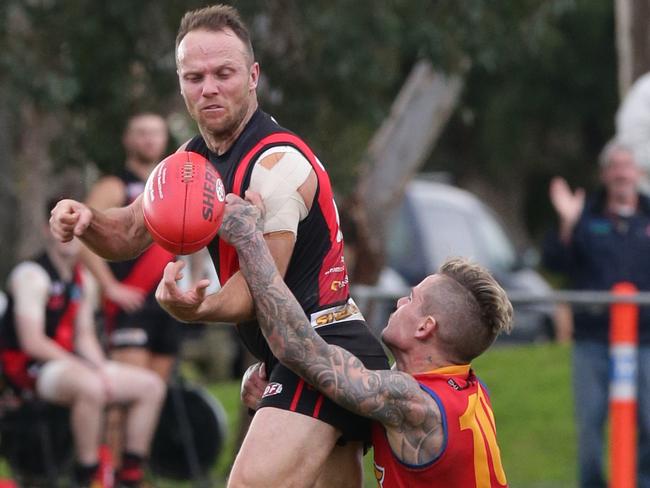 Leader .EDFL footy: Pascoe Vale v Maribyrnong Park.Pascoe Vales Craig Anderson gets tackled by Zac KeoghPicture Andrew Tauber