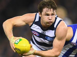 MELBOURNE, AUSTRALIA - JUNE 11: Patrick Dangerfield of the Cats breaks free of a tackle by Luke McDonald of the Kangaroos during the round 12 AFL match between the Geelong Cats and the North Melbourne Kangaroos at Etihad Stadium on June 11, 2016 in Melbourne, Australia. (Photo by Quinn Rooney/Getty Images)