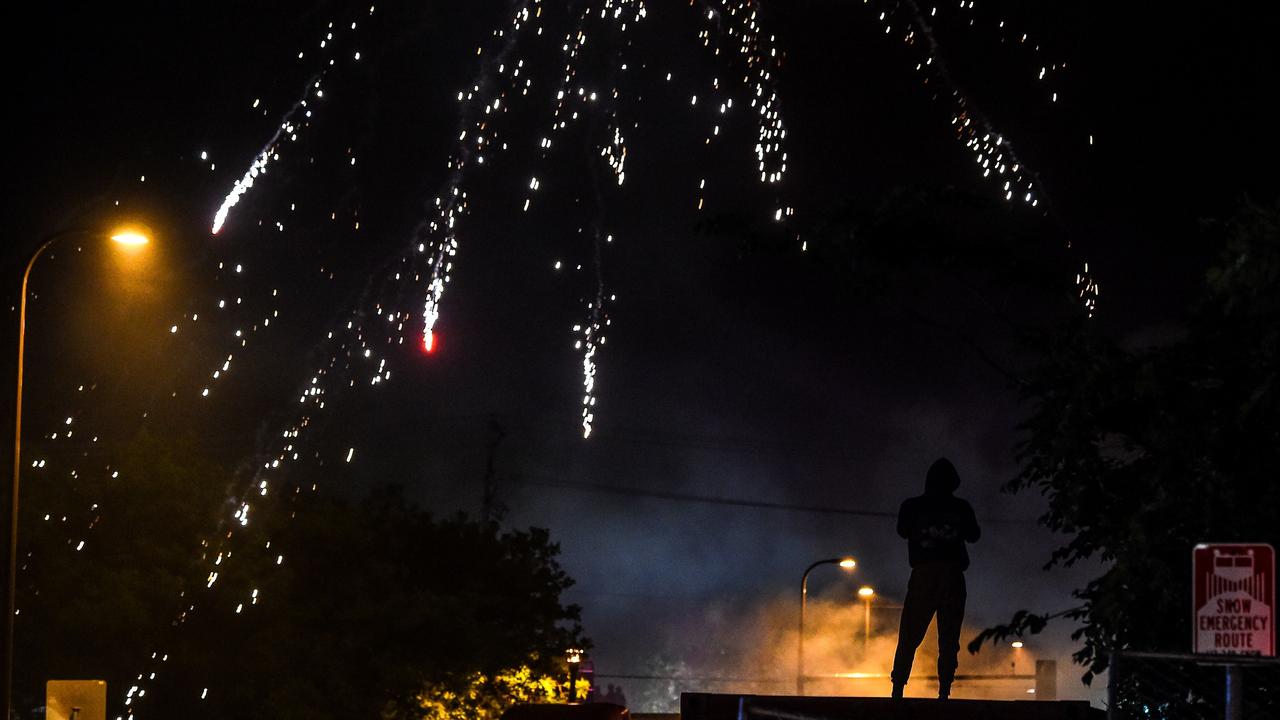 Fireworks explode over the smoky expanse in the city. Picture: Chandan Khanna / AFP