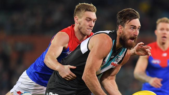 Charlie Dixon of the Power handballs during the round 14 AFL match between the  Power and the  Demons at Adelaide Ova. Picture: Daniel Kalisz/Getty Images