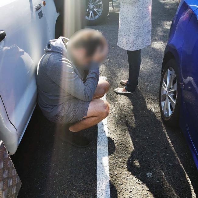 Harden with his head in his hands after being arrested