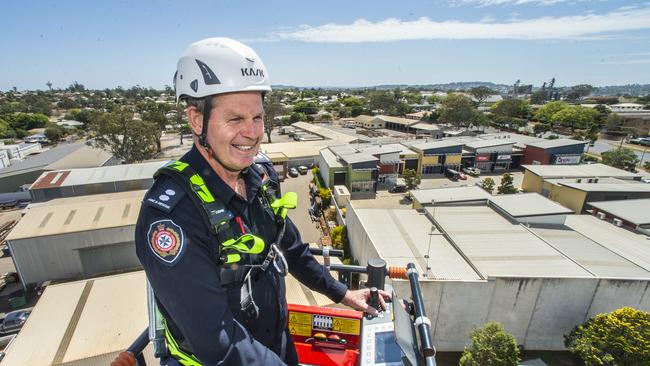 Station Officer David Crighton in the cage of the new CAPA (Combined Aerial Pump Appliance) operating in Toowoomba.