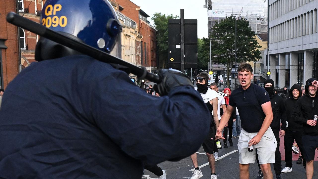 Riot police face protesters in Bristol. Picture: Justin Tallis/AFP