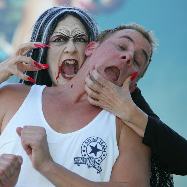 Gold Coast City Councillor Jan Grew is dressed up as Dracula. She is with Movie World performer Tom Gillinder.