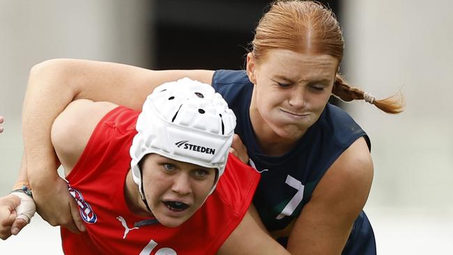 MELBOURNE, AUSTRALIA - APRIL 06:  Sophie McKay of the AFL National Academy Girls tackles Seisia White of the U23 All-Stars during the Marsh AFL National Academy Girls vs U23 All-Stars at Ikon Park on April 06, 2024 in Melbourne, Australia. (Photo by Darrian Traynor/AFL Photos/via Getty Images)