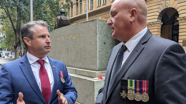 Labor’s veterans affairs spokesman Greg Warren and Veterans Minister David Elliott are both former service members.