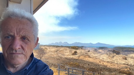 Dolphin Sands resident Harry Curry showing the scale of destruction around his property. Picture: Supplied