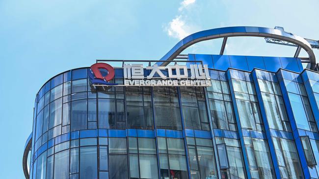 The Evergrande property group until recently held a 36 per cent stake in Shengjing Bank. Above, the Evergrande Center building in Shanghai. Picture: Hector Retamal / AFP