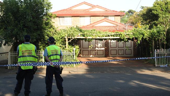 Police outside the home where the incident happened. Picture: John Grainger