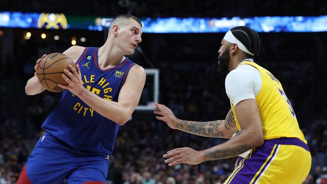 Nikola Jokic #15 of the Denver Nuggets looks to pass the ball against Anthony Davis #3 of the Los Angeles Lakers during the third quarter in game one of the Western Conference Finals at Ball Arena on May 16, 2023 in Denver, Colorado