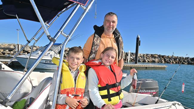 Michael Ness with his children Eric, and Megan at West Beach after Nathan was bitten. Picture: Brenton Edwards