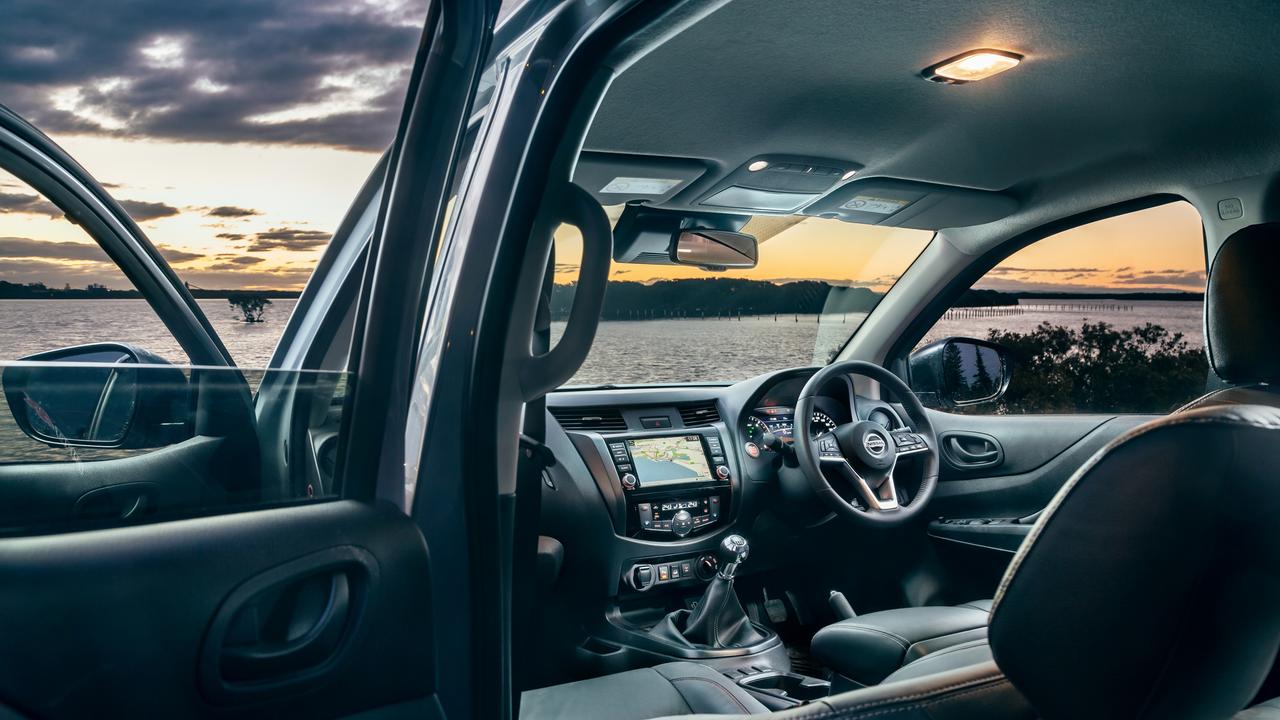 Interior features of the Nissan Navara Pro-4X Warrior include leather trim, an eight-inch touch screen and dual-zone aircon.