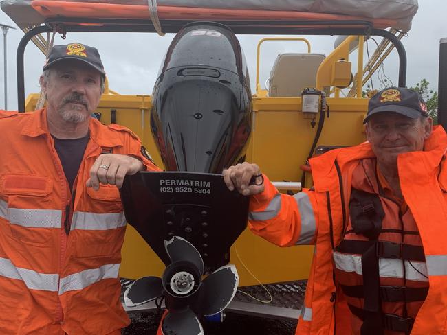 SES Mackay volunteers Dave Rover (left) and Brian Kunst by the Pioneer River on January 16, 2023. Picture: Duncan Evans