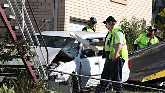 Investigators at the scene of a fatal crash at Stafford. Picture: Annette Dew