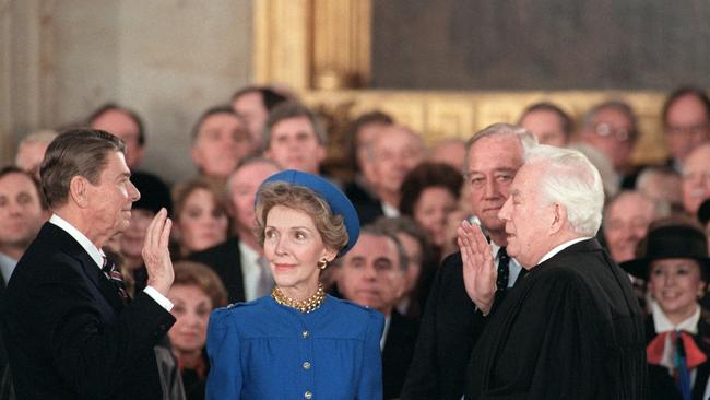 US President Ronald Reagan is sworn in as 40th President of the United States beside his wife Nancy Reagan. Picture: AFP